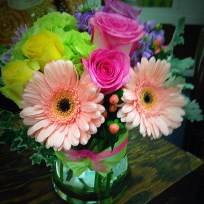 Pink gerbera daisy and rose arrangement